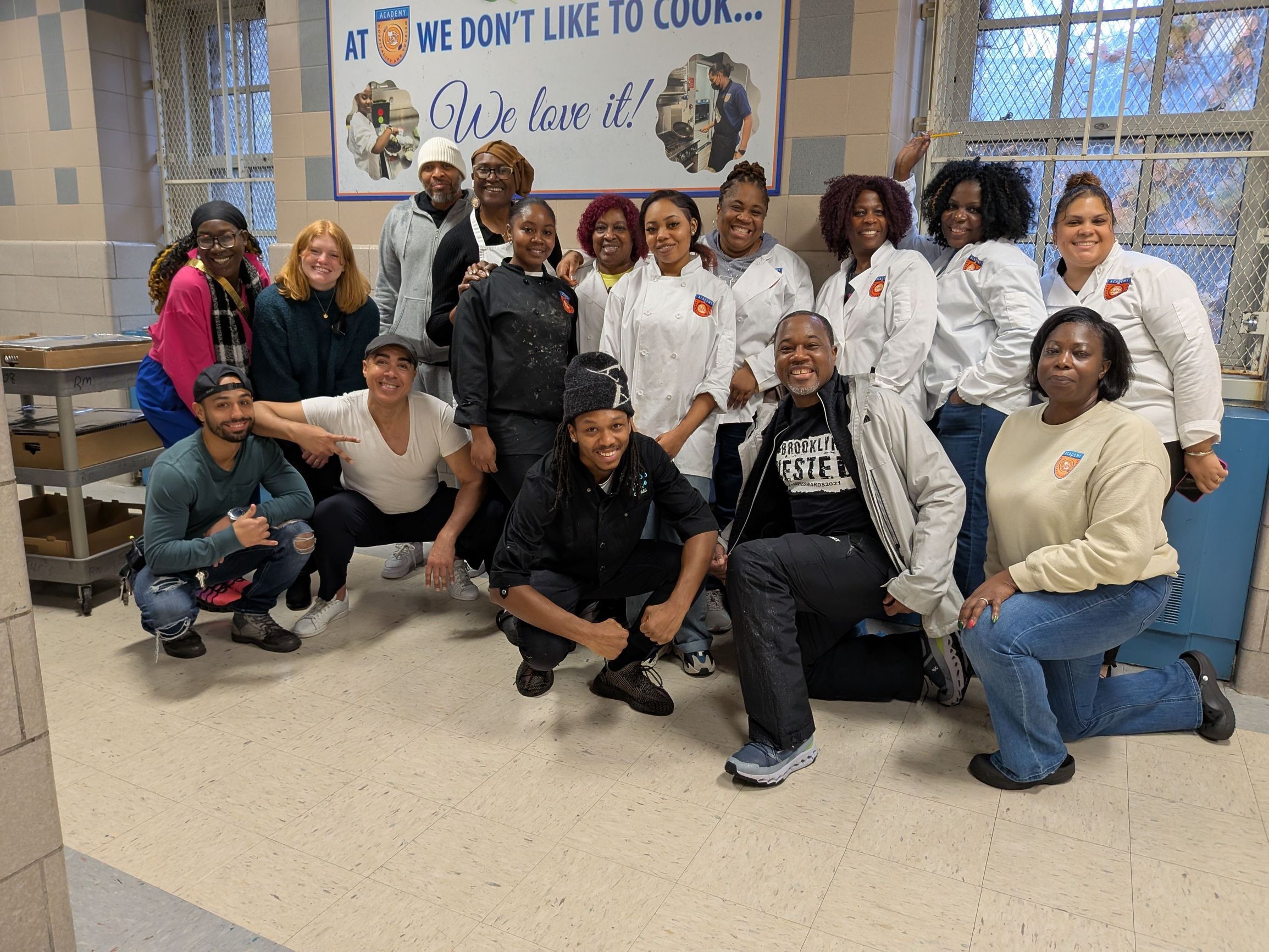 Khari Edwards with Hospitality and Tourism at Erasmus High school students to  serve meals for Thanksgiving 